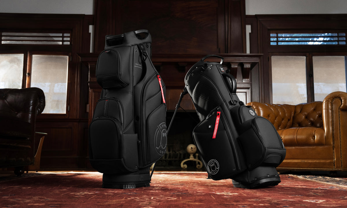 Lifestyle shot of a stand bag and cart bag displayed together in a vintage-style living room.