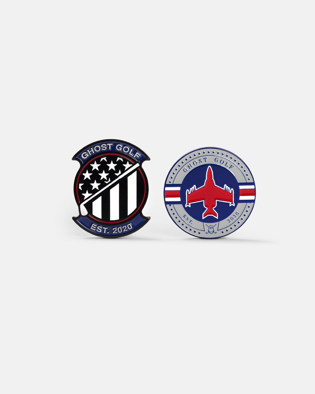 Product photo of two circular ball markers: one featuring a fighter jet design with red, white, and blue accents and the Ghost Golf name and logo; the other showcasing a patriotic Ghost Golf emblem with stars and stripes, a golf club crossing diagonally through the center, the Ghost Golf name at the top, and “EST. 2020” at the bottom.