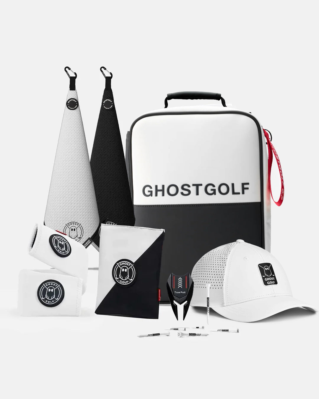 Product Shot of Oreo Bundle showcasing 2 greenside magnetic towels, utility pouch, cart strap sleeve, golf hat, divot tool, and golf tees