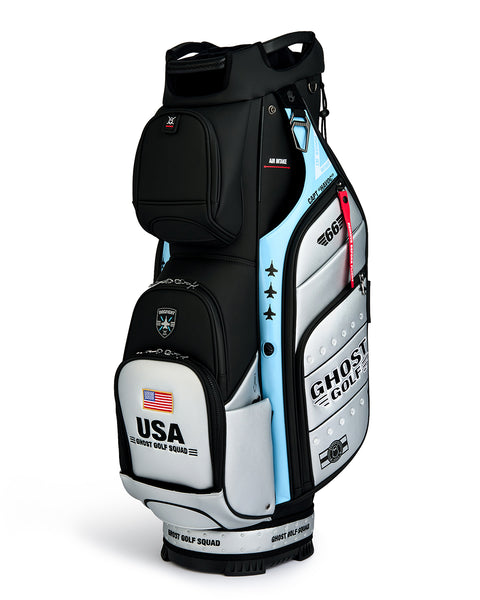 Three Quarter product shot of the Striker GT-14 cart Bag  featuring Ghost Golf branding and an embroidered USA flag on the front ball pocket. Clean product image highlighting the bag’s premium construction, functional stand design, patriotic detailing, and signature Ghost Golf styling.