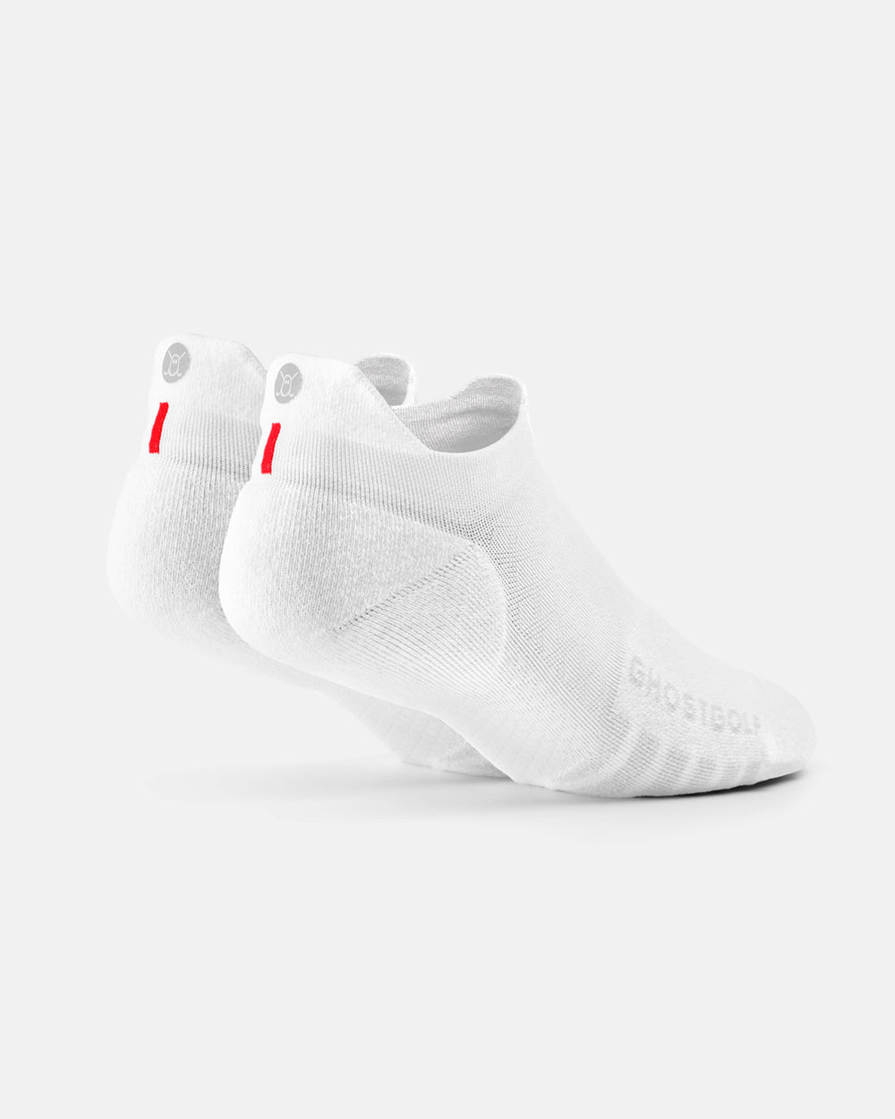 Back product shot of white ankle socks featuring a Ghost icon logo at the back ankle, a red stripe underneath, and the Ghost Golf wordmark near the toe. #color_white
